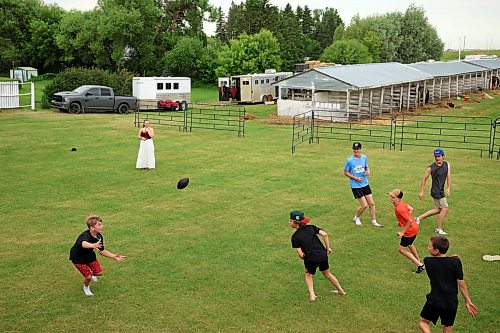 Kids play football at the 138th Annual Strathclair Agricultural Society Fair on Tuesday. The fair included light, heavy and miniature horse shows, a beef show, a pancake breakfast, a fair day parade, a petting zoo, entertainment, judging of horticulture, hand work, baking and art, food and entertainment and a variety of other events. (Tim Smith/The Brandon Sun)
