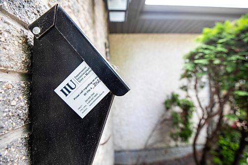MIKAELA MACKENZIE / FREE PRESS
	
An IIU business card in a mailbox on Avon Gate in Linden Woods on Tuesday, July 14, 2026. 

For Scott story.
Free Press 2026