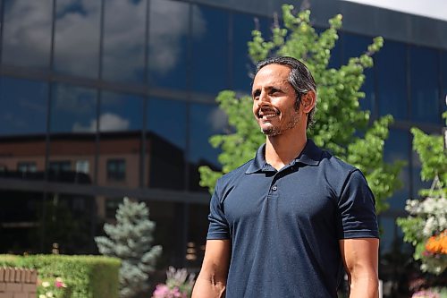 Enver Naidoo, the CEO of Westman Immigrant Services and a candidate for Ward 3 in the October election, stands outside city hall after announcing his election bid. (Alex Lambert/The Brandon Sun)