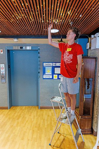MIKE DEAL / FREE PRESS
Summer student, Landen Goundry, turns on the fairy lights for the residents.
The Convalescent Home of Winnipeg at 276 Hugo Street North, is one of Canada's top-rated senior personal care homes.
Reporter: Janine LeGal
260714 - Tuesday, July 14, 2026.