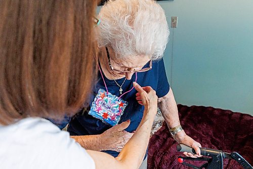 MIKE DEAL / FREE PRESS
Resident, Pauline Kolbuck, puts on her name tag which she made during an activity earlier in the week.
The Convalescent Home of Winnipeg at 276 Hugo Street North, is one of Canada's top-rated senior personal care homes.
Reporter: Janine LeGal
260714 - Tuesday, July 14, 2026.