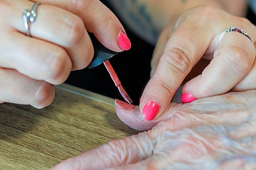 MIKE DEAL / FREE PRESS
Jackie Goundry, Health Care Aide, paints resident Margaret Ward’s nails.
The Convalescent Home of Winnipeg at 276 Hugo Street North, is one of Canada's top-rated senior personal care homes.
Reporter: Janine LeGal
260714 - Tuesday, July 14, 2026.