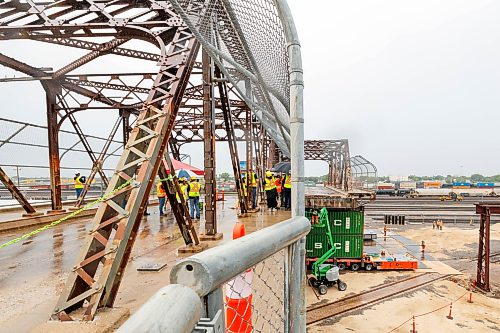 MIKE DEAL / FREE PRESS
Spane #15 of the Arlington Street Bridge is the first to be removed during the two year demolition project Thursday morning. By the end of the year most of the southern half of the bridge should be demolished.
Winnipeg Mayor Scott Gillingham was on hand to watch the start of the historic bridges removal.
Reporter: Malak Abas
260716 - Thursday, July 16, 2026.