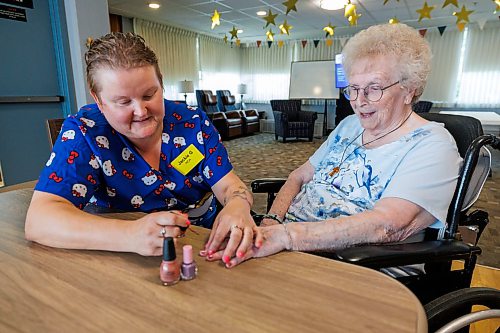 MIKE DEAL / FREE PRESS
Jackie Goundry, Health Care Aide, paints resident Margaret Ward’s nails.
The Convalescent Home of Winnipeg at 276 Hugo Street North, is one of Canada's top-rated senior personal care homes.
Reporter: Janine LeGal
260714 - Tuesday, July 14, 2026.
