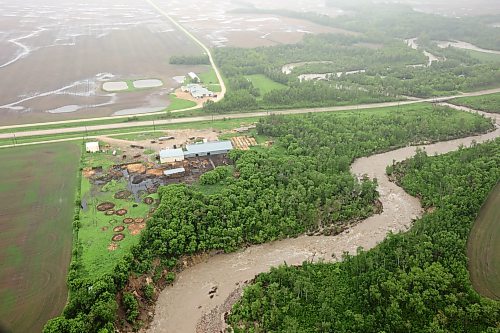 10062026
Flooding in farmland along Highway 10 between Minitonas and Swan River, Manitoba is visible from a helicopter during rain on Wednesday after intense rainfall this week caused widespread flooding in the region. Manitoba Premier Wab Kinew toured the affected areas Wednesday. 
(Tim Smith/The Brandon Sun)
