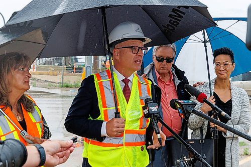 MIKE DEAL / FREE PRESS
Winnipeg Mayor Scott Gillingham was on hand to watch the start of the historic bridges removal talking to media with some city councillors on hand, (from left) Janice Lukes, Ross Eadie and Vivian Santos.
Spane #15 of the Arlington Street Bridge is the first to be removed during the two year demolition project Thursday morning. By the end of the year most of the southern half of the bridge should be demolished.
Reporter: Malak Abas
260716 - Thursday, July 16, 2026.