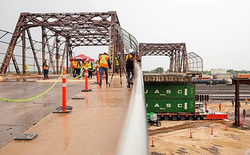MIKE DEAL / FREE PRESS
Spane #15 of the Arlington Street Bridge is the first to be removed during the two year demolition project Thursday morning. By the end of the year most of the southern half of the bridge should be demolished.
Winnipeg Mayor Scott Gillingham was on hand to watch the start of the historic bridges removal.
Reporter: Malak Abas
260716 - Thursday, July 16, 2026.