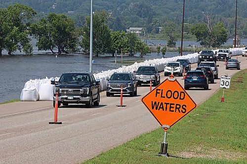 16072026
Traffic passes by the flood water continuing to inundate Dinsdale Park in Brandon as water levels in the Assiniboine River continue to go down on Thursday.
(Tim Smith/The Brandon Sun)