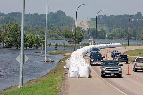 16072026
Traffic passes by the flood water continuing to inundate Dinsdale Park in Brandon as water levels in the Assiniboine River continue to go down on Thursday.
(Tim Smith/The Brandon Sun)