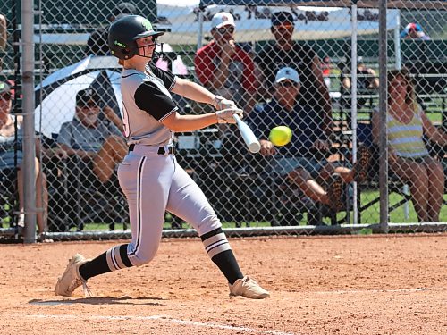 Eastman Wildcats hitter Cameron Heppner drives in a run with a shot to left field in a game against the Westman Magic during the second day of competition at Softball Manitoba's under-17 provincial championship at Ashley Neufeld Softball Complex on Friday afternoon. The Wildcats won a 10-1 mercy-rule victory. (Perry Bergson/The Brandon Sun)
July 16, 2026