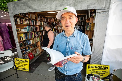 MIKAELA MACKENZIE / FREE PRESS
	
John Thompson at his Fringe Festival Bookman stand on Friday, July 17, 2026. 

For Ben W story.
Free Press 2026