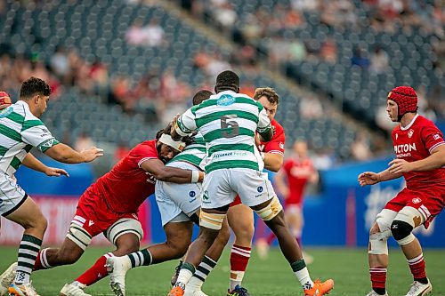 BROOK JONES/FREE PRESS
Canadian men’s national rugby union face No. 24 Zimbabwe In the third match of pool play in the inaugural World Rugby Nations Cup at Princess Auto Stadium in Winnipeg, Man., Saturday, July 18, 2026. Canada earned a 23-19 victory over Zimbabwe. Pictured: Team Canada player Izzak Kelly (No. 5) and Team Canada teammate Cole Keith (No. 3) tackle a Zimbabwe player, while Team Canada player SiÃ´n Parry (No. 7) looks on during first half action. 	