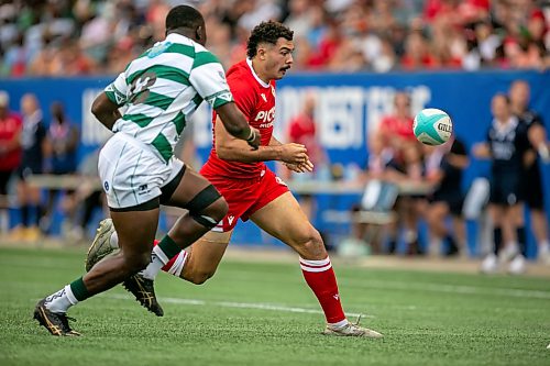 BROOK JONES/FREE PRESS
Canadian men’s national rugby union face No. 24 Zimbabwe In the third match of pool play in the inaugural World Rugby Nations Cup at Princess Auto Stadium in Winnipeg, Man., Saturday, July 18, 2026. Pictured: Team Canada player Noah Flesch (No. 11) runs towards the ball while Team Zimbabwe Brandon Mudzekenyedzi (No. 13) covers him during first half action.