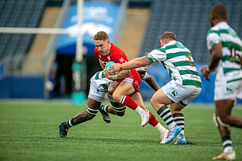 BROOK JONES/FREE PRESS
Canadian men’s national rugby union face No. 24 Zimbabwe In the third match of pool play in the inaugural World Rugby Nations Cup at Princess Auto Stadium in Winnipeg, Man., Saturday, July 18, 2026. Pictured: Team Canada player Cooper Coates (No. 10) runs with the ball while Zimbabew player (No. 7) and Zimbabew teammate (No. 1) try to tackle him during first half.