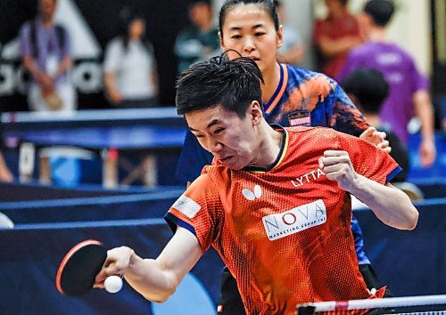 JOHN WOODS / FREE PRESS
Edward Ly returns the serve as his teammate Mo Zhang looks on in the National Table Tennis Championships senior mixed doubles at the University of Winnipeg Sunday, July 19, 2026.
reporter: standup