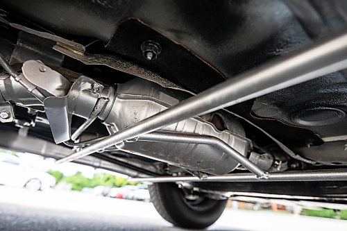 MIKAELA MACKENZIE / FREE PRESS
Harvey Tschetterճ catalytic converter, with a cage installed to deter thefts, on Monday, July 20, 2026.
For front & centre story.
Free Press 2026