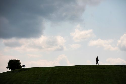 MIKAELA MACKENZIE / FREE PRESS
A person walks over the horizon as strong winds blow clouds past at Westview Park on Monday, July 20, 2026.
Standup.
Free Press 2026