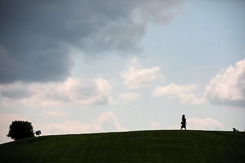 MIKAELA MACKENZIE / FREE PRESS
A person walks over the horizon as strong winds blow clouds past at Westview Park on Monday, July 20, 2026.
Standup.
Free Press 2026