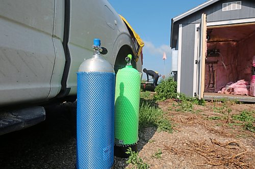 Oxygen tanks used to dive last week at Shoal Lake. (Connor McDowell/The Brandon Sun)