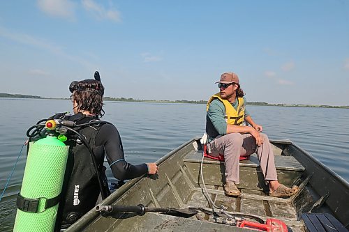 Staff from AAE Tech Services leave off the shore onto Shoal Lake to check on underwater bubblers last week. (Connor McDowell/The Brandon Sun)