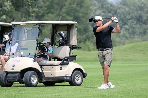 Doug Penner hits his second shot on the 15th hole. (Thomas Friesen/The Brandon Sun)