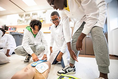 MIKAELA MACKENZIE / FREE PRESS
Samuel Guan (left), Samuel Fadiya, and Ayomipo Oduntan try out an AED simulation at a Biomedical Youth Program Summer Camp at the University of Manitoba Rady faculty of health sciences on Wednesday, July 22, 2026.
Standup.
Free Press 2026