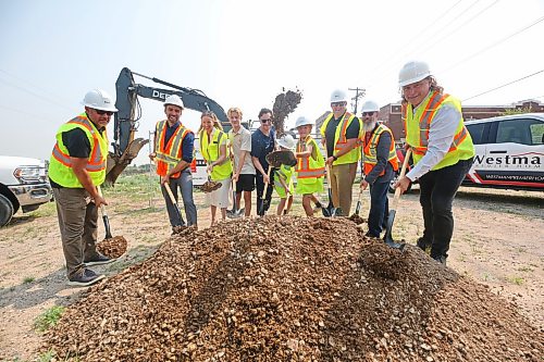 Shovels of dirt fly during a groundbreaking ceremony for the construction of a 72-unit multi-family residential development at 1200 Pacific Avenue on Wednesday. The Eddy Residences project, named after the former Prince Edward Hotel that once stood in Brandon’s downtown, is valued at an estimated $19.2 million. Pictured are, from left, Mark Chartrand with Keller Developments, City of Brandon Planning director Ryan Nickel, Sneath Group CEO Robyn Sneath, her son Beck Sneath, husband Jason Sneath, daughter Imogen Sneath and son Ellar Sneath, Keller Developments president Evan Keller, Construction Association of Rural Manitoba executive director Shawn Wood and Brandon Mayor Jeff Fawcett. (Matt Goerzen/The Brandon Sun)
