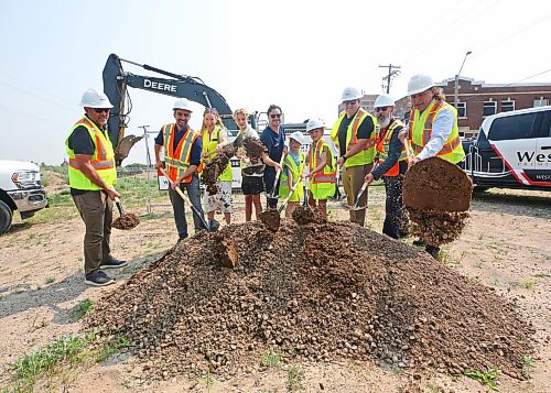 Shovels of dirt fly during a groundbreaking ceremony for the construction of a 72-unit multi-family residential development at 1200 Pacific Avenue on Wednesday. The Eddy Residences project, named after the former Prince Edward Hotel that once stood in Brandon’s downtown, is valued at an estimated $19.2 million. Pictured are, from left, Mark Chartrand with Keller Developments, City of Brandon Planning director Ryan Nickel, Sneath Group CEO Robyn Sneath, her son Beck Sneath, husband Jason Sneath, daughter Imogen Sneath and son Ellar Sneath, Keller Developments president Evan Keller, Construction Association of Rural Manitoba executive director Shawn Wood and Brandon Mayor Jeff Fawcett. (Matt Goerzen/The Brandon Sun)