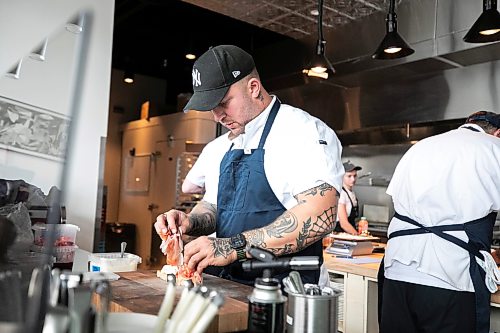 MIKAELA MACKENZIE / FREE PRESS
Brent Genyk, co-owner and head chef of Sottobraccio, prepares dishes at the new Italian restaurant in Osborne Village on Wednesday, July 22, 2026.
For Eva story.
Free Press 2026