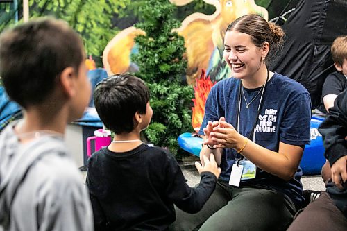 MIKAELA MACKENZIE / FREE PRESS
	
Hayley Toet plays clapping games with the kids at the Inner City Youth Alive vacation bible school day camp on Thursday, July 16, 2026. 

For Zoe story.
Free Press 2026