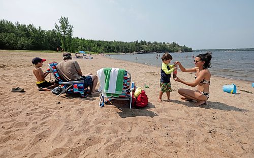 Ruth Bonneville / Free Press
Local RCMP update Nutimik search
Photo of Young family, mother, Elena Davidenko, her husband Len Peterson and their two boys, Forrest (8yrs) and Stanley (3yrs), share their sombre thoughts while spending the day with their kids at Nutimik Beach Thursday.
Story: RCMP confirmed at presser at the boat launch at Nutimik Lake that the body of the missing 10-year-old boy has been recovered following days of an intensive search near the falls at Nutimik Lake. Search and rescue teams including the RCMP, charitable organizations, local businesses and the members of the public continue to search for his 13-year-old brother.
Two boys, aged 10 and 13, slipped into the fast-moving rapids near Sturgeon Falls Trail in Manitoba's Nutimik Lake last Saturday, July 18th while with family,
See story by Moe
July 23rd, 2026