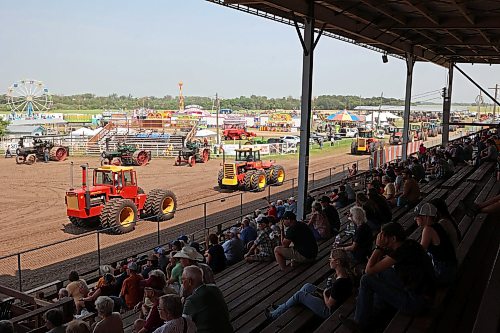 23072026
Antique tractors parade past audience members in the grandstand during the Pioneer Power Parade at the opening day of the 2026 Manitoba Thresherman’s Reunion and Stampede on Thursday afternoon.
(Tim Smith/The Brandon Sun)