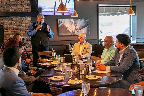 BROOK JONES/FREE PRESS
Members of the Indigenous Taxi Safety Committee and representatives from Duffy's Taxi and Unicity Taxi attend a breaking bread dinner with Winnipeg mayor Scott Gillingham at the Pony Corral on Nairn Avenue in Winnipeg, Man., Thursday, July 23, 2026. The event was held as a way to celebrate reconciliation and the taxi safety partnerships. Pictured: Eric Robinson (left) who is chairman of the taxi safety committee and Winnipeg Mayor Scott Gillingham (right).