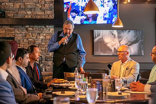 BROOK JONES/FREE PRESS
Members of the Indigenous Taxi Safety Committee and representatives from Duffy's Taxi and Unicity Taxi attend a breaking bread dinner with Winnipeg mayor Scott Gillingham at the Pony Corral on Nairn Avenue in Winnipeg, Man., Thursday, July 23, 2026. The event was held as a way to celebrate reconciliation and the taxi safety partnerships. Pictured: Eric Robinson (left) who is chairman of the taxi safety committee and Winnipeg Mayor Scott Gillingham (right).
