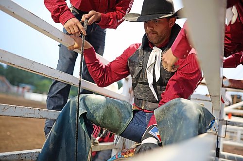 Josia Ritter of Germany prepares to compete in the bull riding event in the opening go-round of the 2026 Manitoba Thresherman’s Reunion and Stampede rodeo to cap off Thursday evening. Ritter, who is in Canada on a temporarily work exchange, had never tried bull riding before. (Tim Smith/The Brandon Sun)