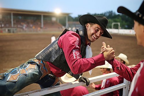 23072026
Josia Ritter of Germany is congratulated as he climbs over the chutes after competing in the bull riding event in the opening go-round of the 2026 Manitoba Thresherman’s Reunion and Stampede rodeo to cap off Thursday evening. Ritter, who is in Canada on a temporarily work exchange, had never tried bull riding before.
(Tim Smith/The Brandon Sun)