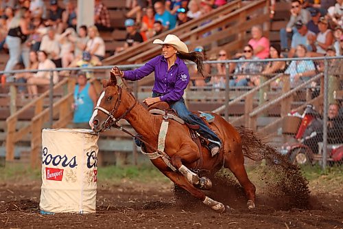 Kaybree Zunti of Unity, Sask., races home after rounding the barrels in Thursday's ladies barrel racing event. (Tim Smith/The Brandon Sun)