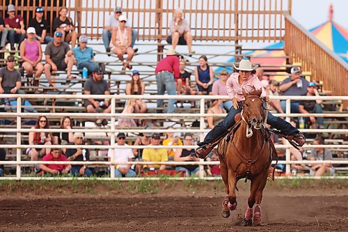 23072026
Rana Beierbach of Whitewood, Saskatchewan races home atop her horse after rounding the barrels in the ladies barrel racing event at the opening go-round of the 2026 Manitoba Thresherman’s Reunion and Stampede rodeo on Thursday evening. (Tim Smith/The Brandon Sun)