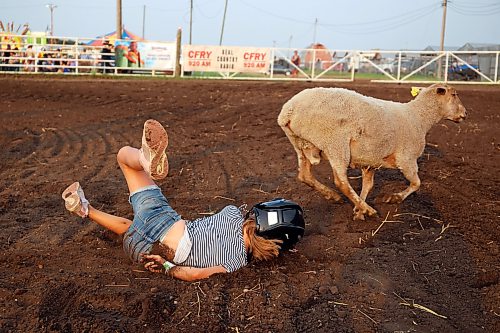 A young mutton busting competitor hits the dirt while competing on Thursday evening. (Tim Smith/The Brandon Sun)