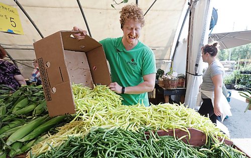 Ruth Bonneville / Free Press
Local St-Léon Gardens - locally grown produce
Photo of Colin Rémillard, co-owner of St-Léon Gardens, restocking his table of locally grown beans, Friday.
Story: locally/Canadian grown produce like what’s offered at St-Léon Gardens and restaurants like at Gather at the Leaf with produce from the kitchen garden and St Norbert’s market.
See story by AV
July 24th, 2026