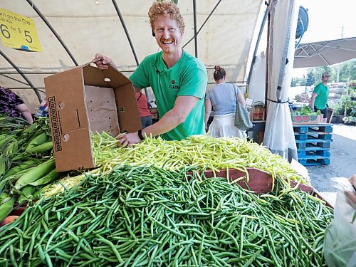 Ruth Bonneville / Free Press

Local St-Léon Gardens - locally grown produce 

Photo of Colin Rémillard, co-owner of St-Léon Gardens, restocking his table of locally grown beans, Friday.  

Story: locally/Canadian grown produce like what’s offered at  St-Léon Gardens and restaurants like at Gather at the Leaf with produce from the kitchen garden and St Norbert’s market.  

See story by AV

July 24th,  2026
