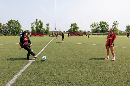 MIKE DEAL / FREE PRESS
Sports, Culture, Heritage and Tourism Minister Nellie Kennedy passes the ball to start a scrimmage for the young athletes after announcing that the provincial government will be investing $750,000 to support upgrades to the Ralph Cantafio Soccer Complex (900 Waverley Street).
Héctor Vergara, executive director, Manitoba Soccer Association, and Raff Cantafio, Cantafio family also spoke, both getting emotional during their speeches.
Reporter: Grace Penner
260724 - Friday, July 24, 2026.