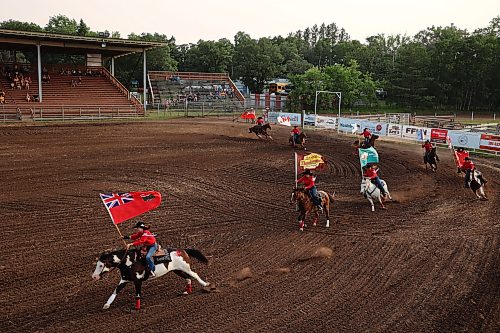 24072026
Flag-bearers ride through the arena at the beginning of the opening go-round of the 2026 Manitoba Thresherman’s Reunion and Stampede rodeo on Thursday evening. (Tim Smith/The Brandon Sun)