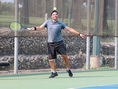Myles Hrubeniuk of Brandon returns a shot by Boyd White of Dauphin during a Wheat City Tennis Club tournament on Saturday morning. In all-Brandon final, Ken Chang defeated Hrubeniuk. (Perry Bergson/The Brandon Sun)
