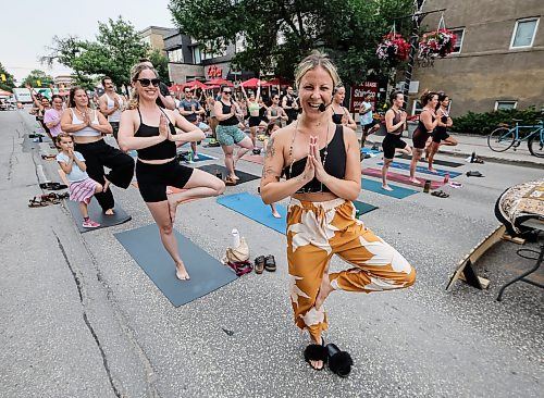 JOHN WOODS / FREE PRESS
Jessica from Rogue Vinyasa Yoga leads a session outside on a closed Corydon Avenue Sunday, July 26, 2026. The city is closing Corydon on multiple Sundays throughout the summer.
reporter: standup