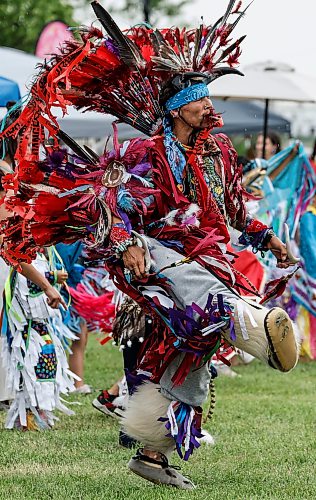 JOHN WOODS / FREE PRESS
People participate in the grand entrance of the powwow at Anishinaabe Days Sunday, July 26, 2026.
reporter: standup
