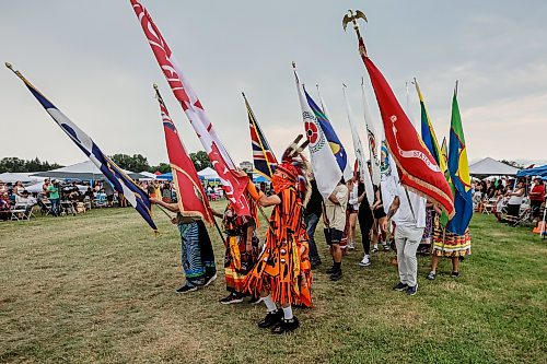 JOHN WOODS / FREE PRESS
People participate in the grand entrance of the powwow at Anishinaabe Days Sunday, July 26, 2026.
reporter: standup