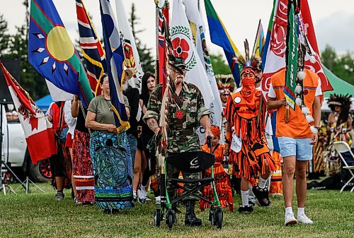 JOHN WOODS / FREE PRESS
People participate in the grand entrance of the powwow at Anishinaabe Days Sunday, July 26, 2026.
reporter: standup
