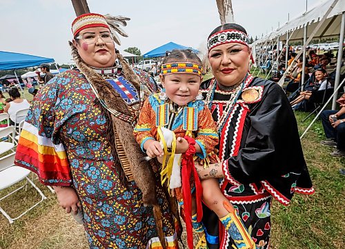 JOHN WOODS / FREE PRESS
Nahanni with her aunt Cayla Houle, left, and mother Destiny Houle wait to participate in the grand entrance of the powwow at Anishinaabe Days Sunday, July 26, 2026.
reporter: standup