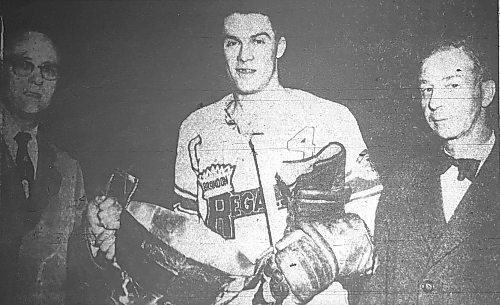 In a picture that ran in The Brandon Sun on April 27, 1957, Western Hockey League president Al Leader presents the President's Cup to Brandon Regals captain Bob Chrystal as owner Jim Piggott looks on after they swept the New Westminster Royals 4-0 in the best-of-seven final. The Regals left the next morning to play in the Edinburgh Cup against the Quebec Aces. This photo is a picture taken of a micofiche image. The original no longer exists. (Brandon Sun files)